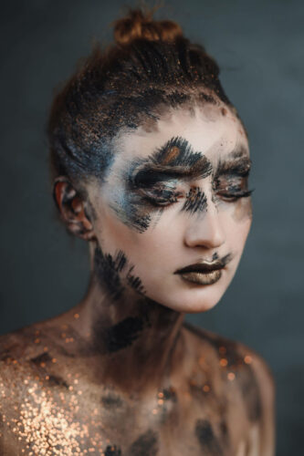 Halloween make up. Portrait pale gothic daemon woman.